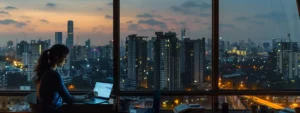 a determined woman in a modern office overlooking the city skyline, working on her laptop as she prepares to unlock her cloud potential as an aws solutions architect in pune.